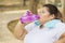 Obese woman drinking water after doing a workout