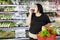 Obese woman eating an organic apple