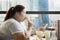 Obese woman enjoying leisure time in the cafe