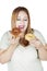 Obese woman holds two donuts