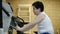 Obesity little kid boy training stationary bike in gym. concept healthy lifestyle