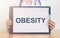 Obesity Word on a white sheet of paper, medical concept