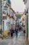 OBIDOS, PORTUGAL - OCTOBER 11, 2017: Tourists in a narrow alley in Obidos villag