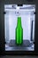 Object green bottle printed on 3D printer close-up, inside on 3d printer.