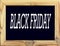 object. Wooden frame with black background and the inscription BLACK Friday, blackboard or school board on white