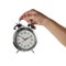 Objects Hands action - Hand holds retro alarm clock. Isolated