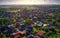 Oblique aerial view of a village in Germany with detached houses, yarns, lawns and roads