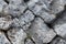 Oblique series of large gray stones uneven background weathered