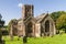 Oblique view of Crowcombe church, Somerset, in autumn sunlight