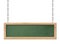 Oblong green blackboard with bright wooden frame hanging on chains