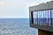 Observation deck with elevator lift to sea promenade, viewing platform for tourism, sea background