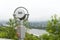 Observation deck for exploring the city. Paid binoculars close-up. Silver telescope for exploring the city