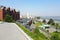 The observation deck in the park overlooks the city, red brick buildings and skyscrapers. Street in the Ukrainian city Dnipro,