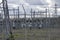 Observation of a power station and its large metal antennas, on a cloudy day, in the countryside