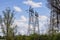 Observation of a power station and its large metal antennas, on a cloudy day, in the countryside