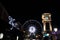 Observation wheel and clock tower in Asiatique night scene