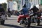 Observers at the Hermitage building observe the passage of a biker column