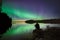 Observing auroras in Swedish lake.