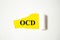 Obsessive Compulsive Disorder the text is written on a white background and a yellow piece of paper. word