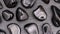 Obsidian rare jewel stones texture on black stone background. Moving right seamless loop backdrop
