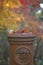 An obsolete rusty mailbox in autumn