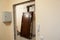 Obsolete steel door is deinstalled from doorframe, flat renovations