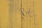 Obsolete yellow painted wooden background texture