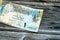 obverse side of 1 Qatari Riyal cash money currency of Qatar banknote features Ornated column, arches, sailboats, palm trees,