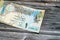obverse side of 1 Qatari Riyal cash money currency of Qatar banknote features Ornated column, arches, sailboats, palm trees,