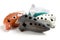 Ocarinas on white background. Orange color ocarina in glaze.