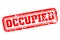 Occupied rubber stamp