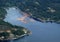 Ocean barges filled with lumber near the shoreline