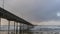 Ocean Beach pier in rainy weather, sea waves in rainfall, California coast, USA.