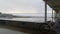 Ocean Beach pier in rainy weather, sea waves in rainfall, California coast, USA.