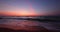 Ocean beach sunrise and dramatic colorful sky clouds.