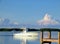 Ocean Fishing Boat out on the bay nearing dock with reflection o