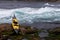 Ocean kayak beached on rocky shore at tidal rapids