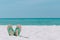 Ocean landscape And sandals on the beach. Welcome summer