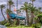 Ocean Race Sailboat monument on roundabout place with palms around, street in central Alicante, close up photo, ALICANTE, SPAIN -