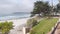 Ocean sandy beach, California coast, sea water wave crashing. Stairs or stairway