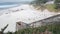 Ocean sandy beach, California coast, sea water wave crashing. Stairs or stairway