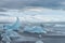 Ocean shore with many icebergs near Jokulsarlon lagoon, Iceland.