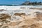 Ocean storm aftermath: A mass of thick foam covered the rocks following extreme storm