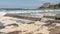 Ocean storm aftermath: A mass of thick foam covered the rocks following extreme storm weather