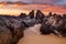 Ocean sunrise with craggy rock channels near Narooma