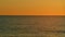 Ocean At Sunset. Right Burning Sunset Above Sea. Sun Is Setting Over Sea Or Ocean. Slow motion.