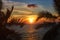 Ocean sunset visible through palm leaves