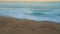 Ocean surf covering sunset shore drone view. Turquoise waves covering beach