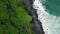 Ocean surf splashing mossy cliffs nature drone top view. Foaming waves beach
