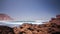 Ocean tide on rocky beach. Water tide on rock shore. Landscape ocean shore